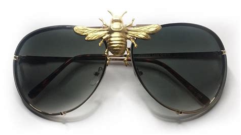 sunglasses with a bee emblem.